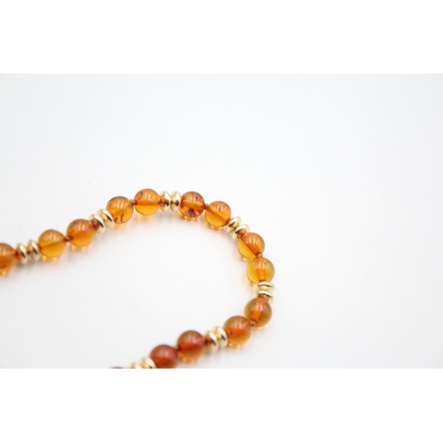 29 - 9ct gold amber and gold spacer beaded necklace (8.4g)