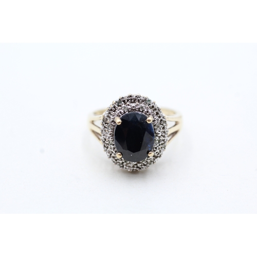 4 - 9ct gold sapphire and diamond halo ring (3.9g) Size P