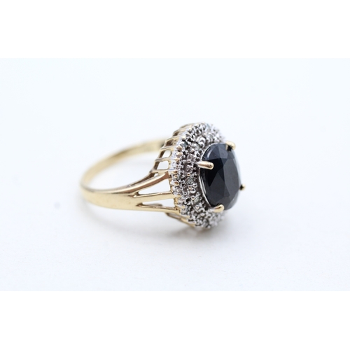 4 - 9ct gold sapphire and diamond halo ring (3.9g) Size P