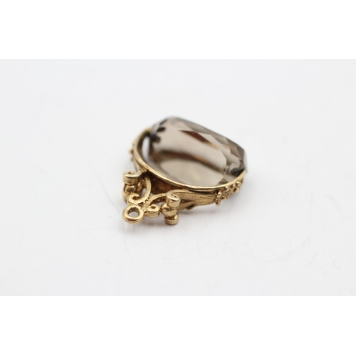 56 - 9ct gold smokey quartz spinner fob (2.7g)