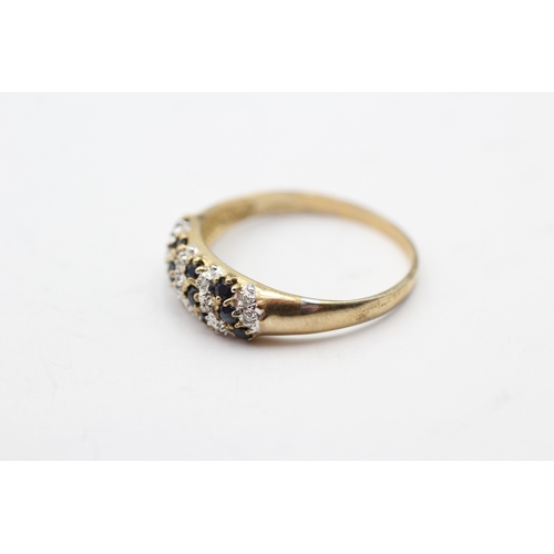 61 - 9ct gold diamond and sapphire cluster row ring (2.5g) Size U