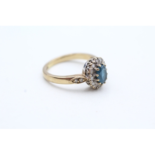 92 - 9ct gold topaz and diamond halo ring (2.5g) Size J