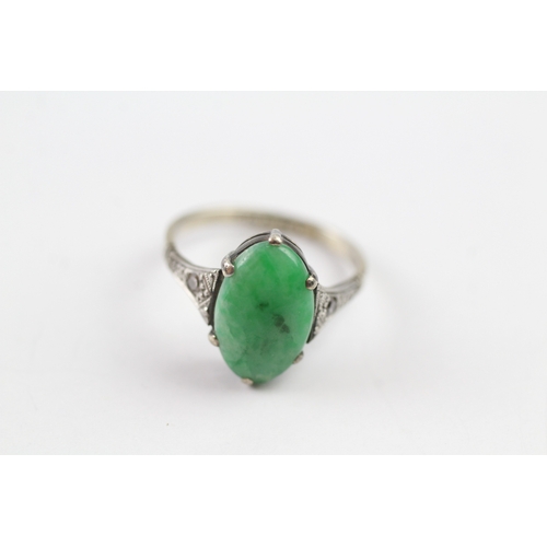 104 - 9ct white gold jade and diamond dress ring (2.2g) Size J 1/2