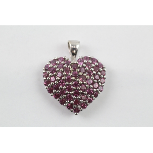 107 - 9ct gold garnet set heart pendant (3.5g)