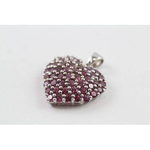 107 - 9ct gold garnet set heart pendant (3.5g)