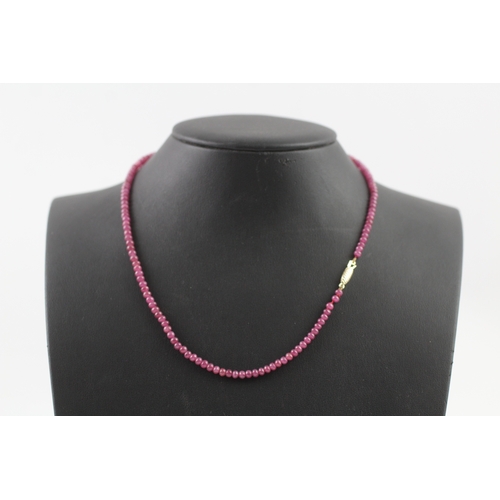 109 - 9ct gold clasped ruby bead necklace (10.4g)