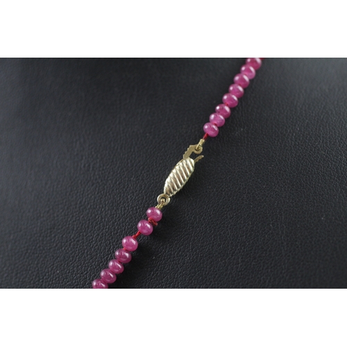 109 - 9ct gold clasped ruby bead necklace (10.4g)