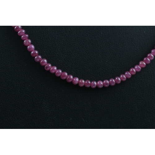 109 - 9ct gold clasped ruby bead necklace (10.4g)