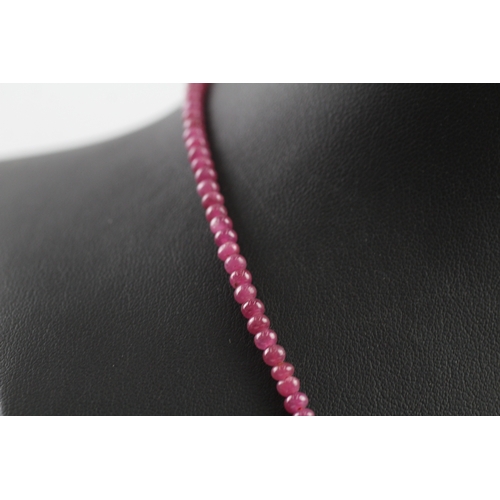 109 - 9ct gold clasped ruby bead necklace (10.4g)