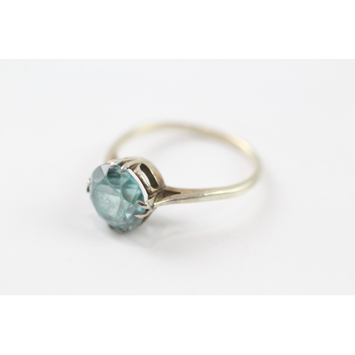 110 - 9ct gold blue zircon solitaire ring (2.4g) Size Q 1/2