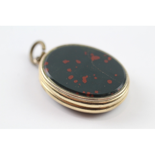 115 - 9ct gold bloodstone and agate locket (11.1g)