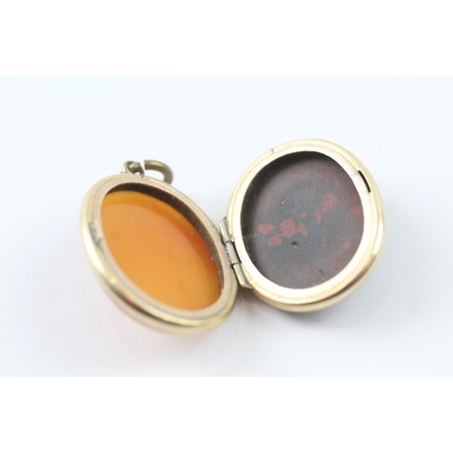 115 - 9ct gold bloodstone and agate locket (11.1g)