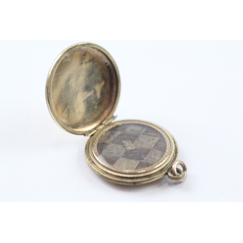 118 - 9ct gold back and front locket (6.3g)