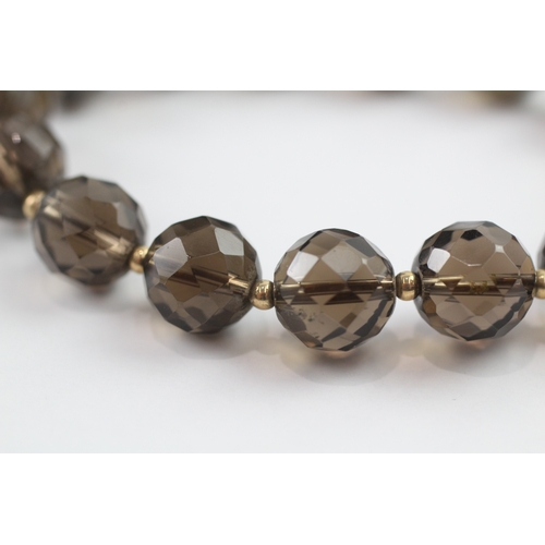 13 - Smoky quartz bead bracelet with 9ct gold spacer beads (23.3g)