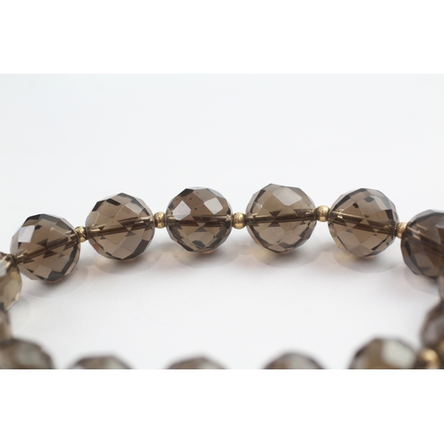 13 - Smoky quartz bead bracelet with 9ct gold spacer beads (23.3g)