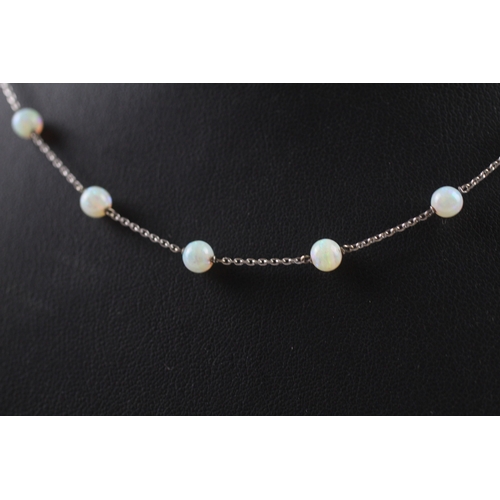 138 - 9ct white gold opal necklace (3.5g)