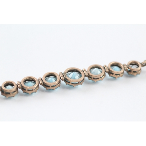 146 - 9ct gold blue zircon bracelet (7g)