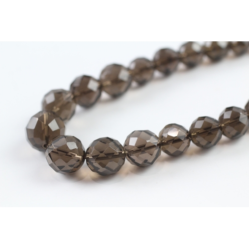 156 - 9ct gold clasped smoky quartz bead necklace by Whitney Kelly (72.6g)