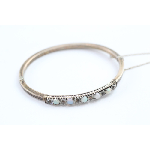 16 - 9ct gold opal and paste set bangle (6.1g)