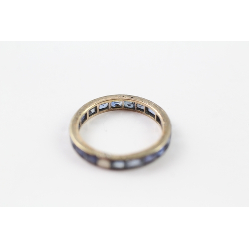 161 - 9ct gold sapphire eternity ring (1.9g) Size M 1/2