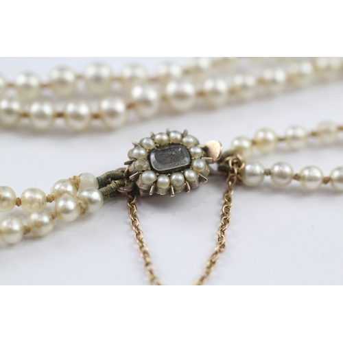 168 - An imitation pearl necklace with a 9ct gold mourning clasp (7.3g)