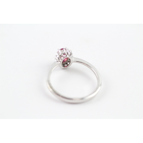 173 - 9ct gold ruby and diamond halo ring (2.2g) Size O