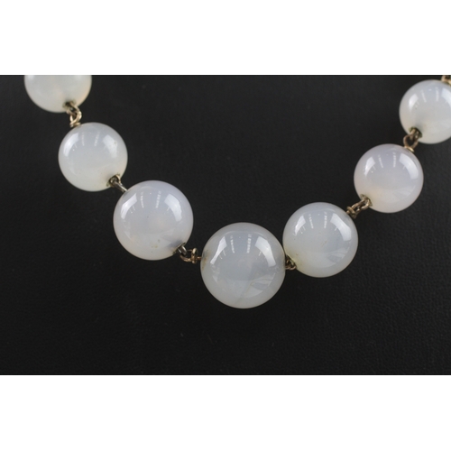 181 - 9ct gold clasped antique chalcedony bead necklace (72.5g)