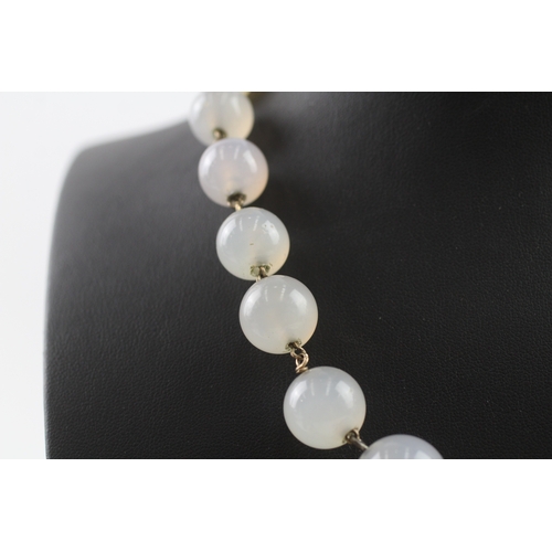 181 - 9ct gold clasped antique chalcedony bead necklace (72.5g)