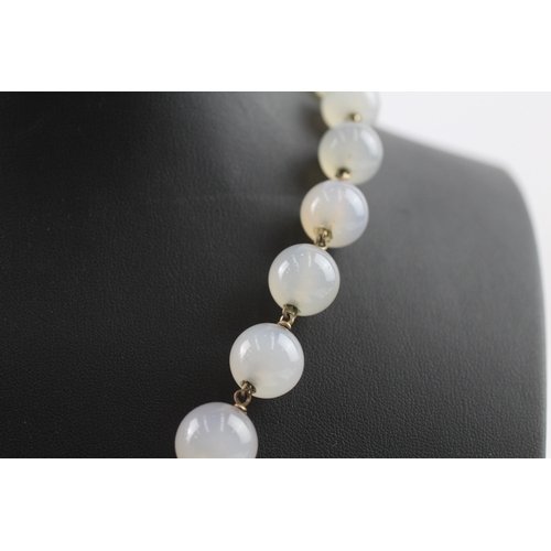 181 - 9ct gold clasped antique chalcedony bead necklace (72.5g)