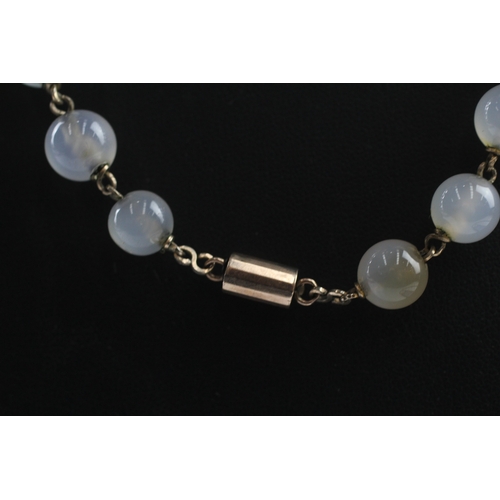 181 - 9ct gold clasped antique chalcedony bead necklace (72.5g)