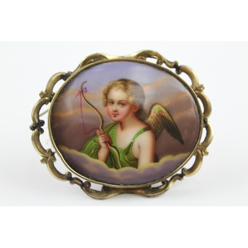 198 - A Victorian hand painted cherub brooch (29g)