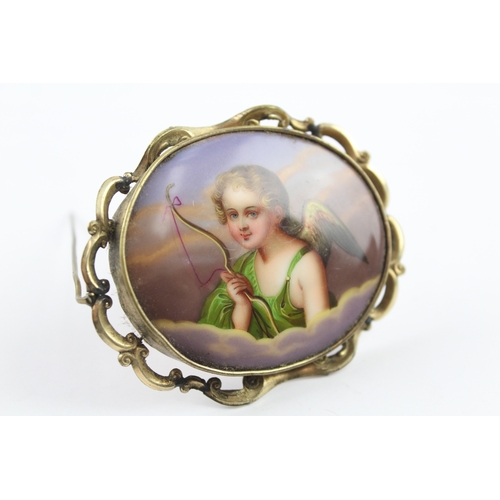 198 - A Victorian hand painted cherub brooch (29g)