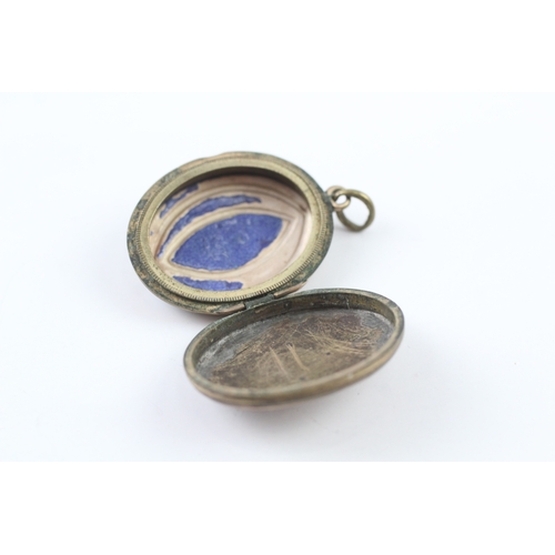 217 - 9ct gold back and front locket with floral enamel detail (10g)