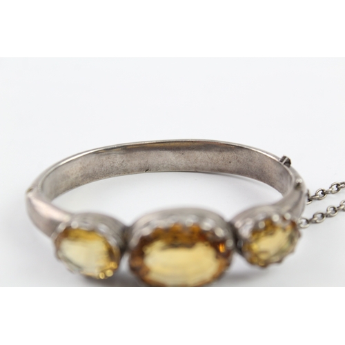 229 - A Victorian silver citrine set bangle (34g)