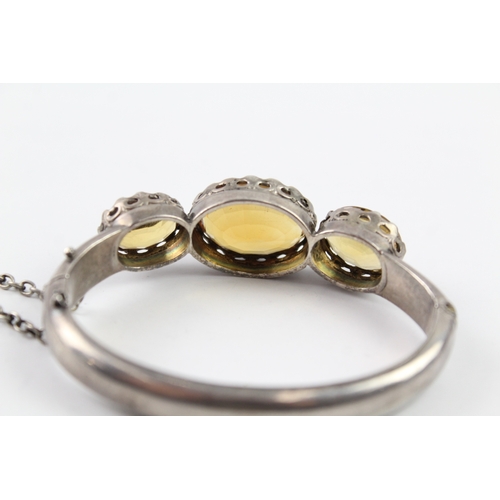 229 - A Victorian silver citrine set bangle (34g)