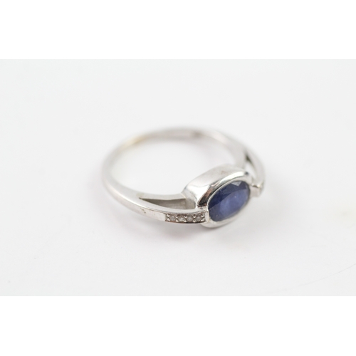 243 - 9ct gold diamond and sapphire dress ring (3.4g) Size P