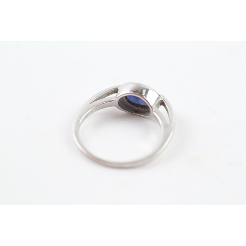 243 - 9ct gold diamond and sapphire dress ring (3.4g) Size P