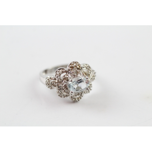 26 - 9ct gold diamond and aquamarine dress ring (3.8g) Size J