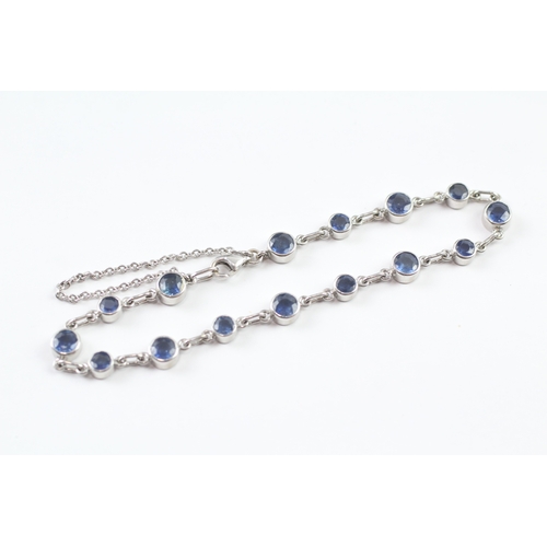 264 - 18ct white gold sapphire bracelet (9.5g)
18.5cm long