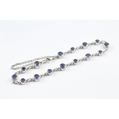 264 - 18ct white gold sapphire bracelet (9.5g)
18.5cm long