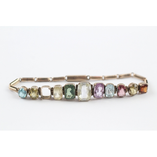 274 - 9ct gold multi stone panel bracelet with garnet, zircon, purple and yellow sapphire (10g)