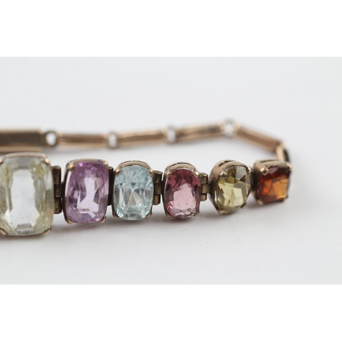 274 - 9ct gold multi stone panel bracelet with garnet, zircon, purple and yellow sapphire (10g)