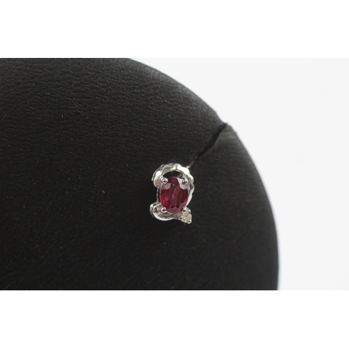 282 - 18ct gold diamond and ruby stud earrings (1.6g)