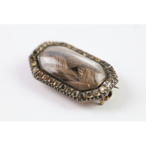 286 - 19th century gold and silver mourning brooch with paste and hairwork (7g)