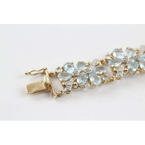 288 - 9ct gold diamond and topaz floral bracelet (18.2g)