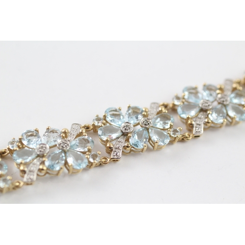 288 - 9ct gold diamond and topaz floral bracelet (18.2g)