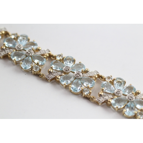 288 - 9ct gold diamond and topaz floral bracelet (18.2g)