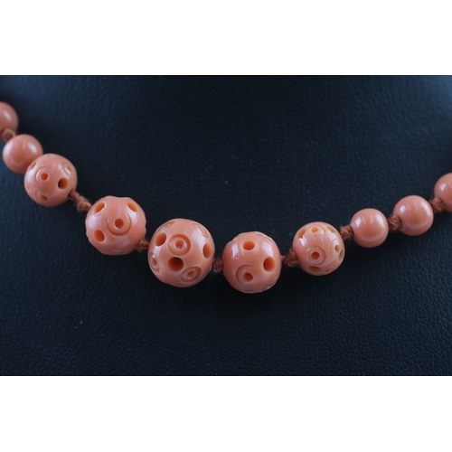 293 - 9ct gold clasped carved galalith bead necklace (6.7g)