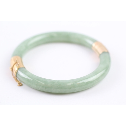 301 - 14ct gold jade bangle (36.4g)