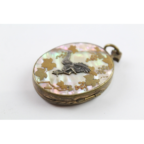 306 - A Japanese Shakudo and mother of pearl locket (15g)